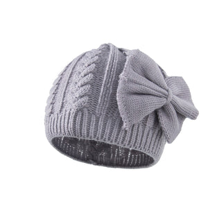 Children's solid color dome bowknot acrylic warm knitted hat